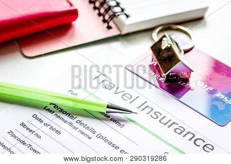 Travel Insurance Application Form On White Desk Background