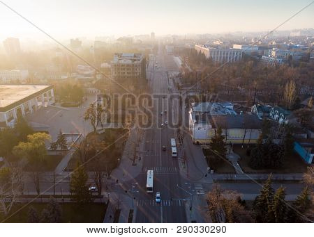 Aerial Drone View Of Stefan Cel Mare Central Boulevard At Sunrise In Chisinau With Cars, Moldova