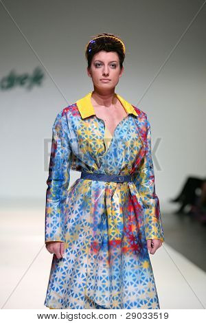 ZAGREB, CROATIA - NOVEMBER 25: Fashion model wears clothes made by Nino Bollag on 'Fashion Week Zagreb' show on November 25, 2011 in Zagreb, Croatia.