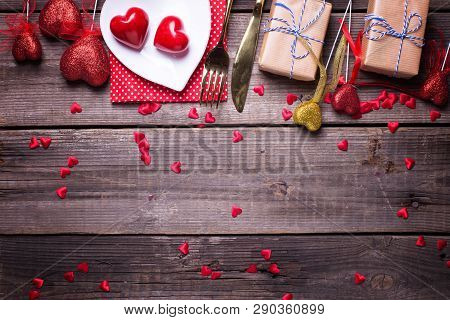 Border From Red  Decorative Hearts, Boxes With Presents And Plate, Cultery On Vintage Wooden Backgro