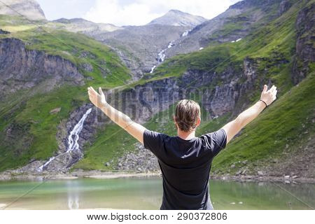 A Young Man Embracing The Nature At The Lake Called Nassfeld Speicher In Hohe Tauern National Park I