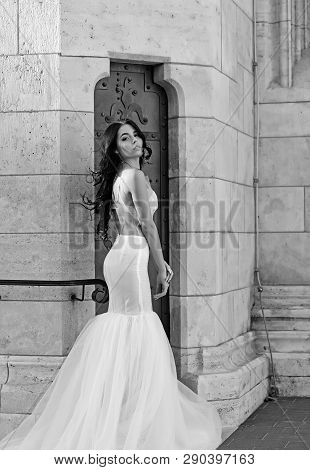 Sexy Girl In White Dress With Stylish Hair. Sexy Girl In White Sedding Dress Pose At Stony Wall.