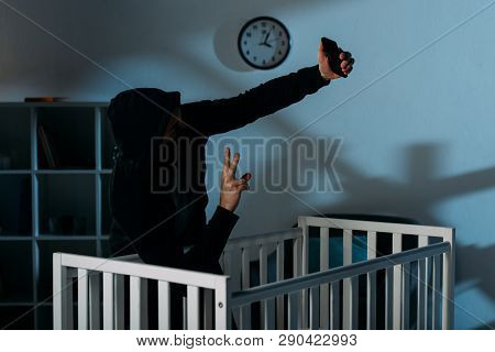 Kidnapper Taking Selfie Near Crib And Showing Peace Sign