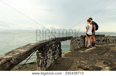 Sanur, Indonesia - March 16, 2019: Couple Of Tourist Enjoying Ocean Morning View At Sanur Bali Beach