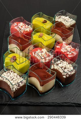 Mini Dessert, Tiramisu, Chocolate And Strawberry Dessert On Dark Background.