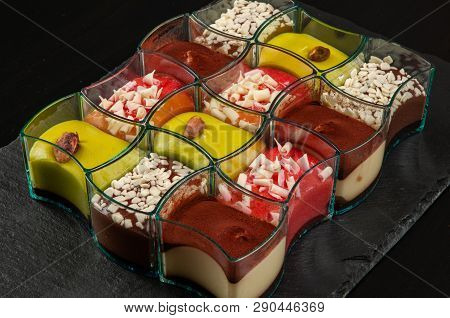 Mini Dessert, Tiramisu, Chocolate And Strawberry Dessert On Dark Background.