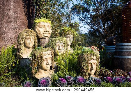 The Statue Of Heads With Grass And Plants Instead Of Hair - Body Parts In Ba Na Hills At Da Nang, Vi