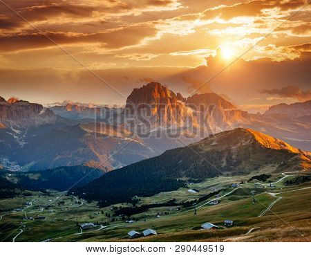 Evening view of the Val Gardena in Dolomite mountains. Location place Dolomiti, Seceda peak, Trentino Alto Adige, province Bolzano, Italy, Europe. Nature wallpapers. Discover the beauty of earth. 