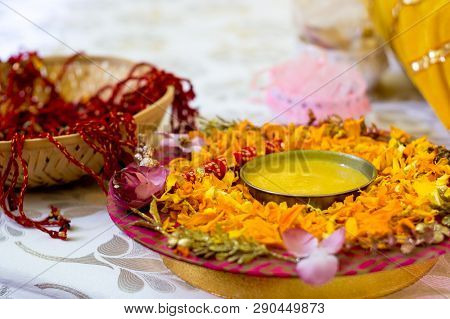 Traditional Haldi Turmeric Kept On A Flower Plate For The Hindu Marriage Ceremony