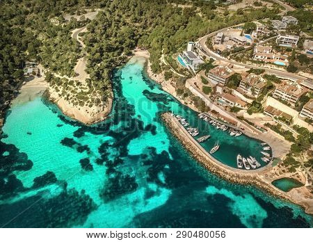 Beautiful birdeye view on the sea coastline with pier and yakhts at sunny day. Travell, jorney,islands, Seascape, freedom, holidays concept.