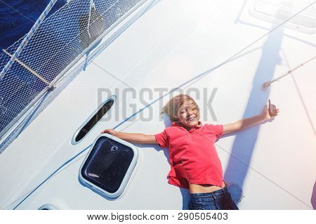 Little Boy On Board Of Sailing Yacht On Summer Cruise. Travel Adventure, Yachting With Child On Fami
