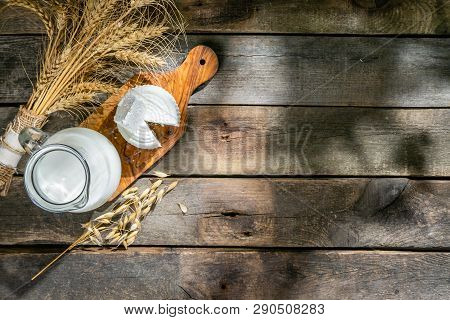Shavout Concept - Grains, Milk And Cheese On Wood Background, Top View