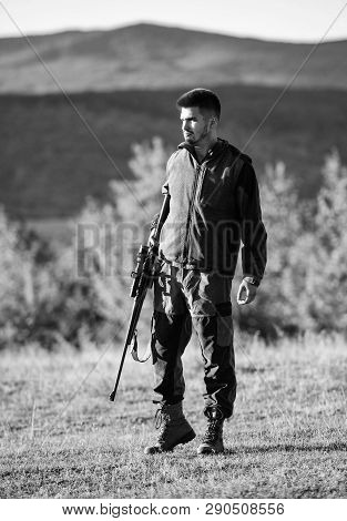 Mental Preparation For Hunting Individual Process. Man Rifle For Hunt. Hunter Khaki Clothes Ready To