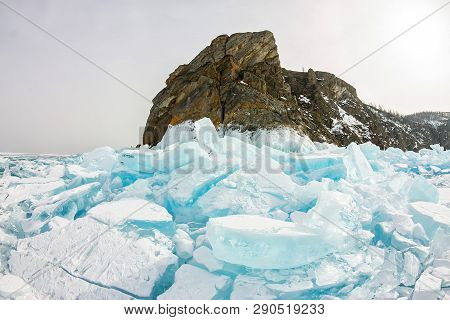 Cape Khoboy Rock On Olkhon Island, Lake Baikal, Ice Hummocks In Winter, Russia, Siberia
