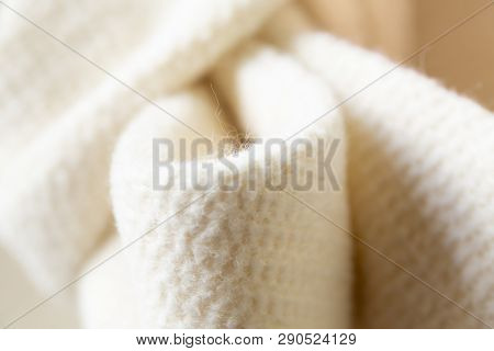 Close-up Of The White Ribbon Of Thick Material.coat Or Jacket.aterial.coat Or Jacket.
