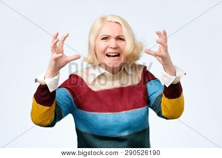 Angry Old Woman Making Angry Facial Gesture On White Background