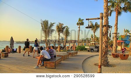 La Mer In Dubai, Uae - May 06, 2018: La Mer  At Sunset:  People Rest On The Beach.  It Is A New Beac
