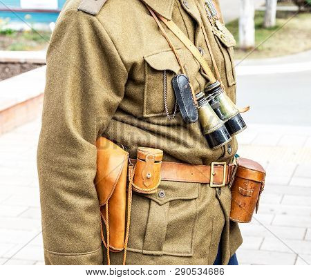Vintage Leather Holster, Binoculars And Other Ammunition On The Belt. Retro Uniform Of Russian Army 