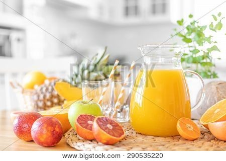 Multifruit Juice And Fresh Fruit On Table On Kitchen Background Closeup