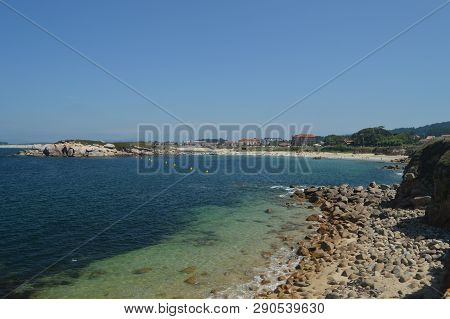 Wonderful Beach Of Area Gorda In La Lanzada In Noalla. Nature, Architecture, History, Travel. August
