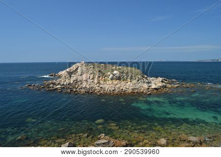 Islet Of The Illariña Turquoise Waters Surrounding Seen From The Fort Of The Hermitage In La Lanzada