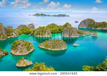 Calm Picturesque tropical lagoon of  islands with reef coastline  and turquoise  water, Indonesia area, Pasific ocean