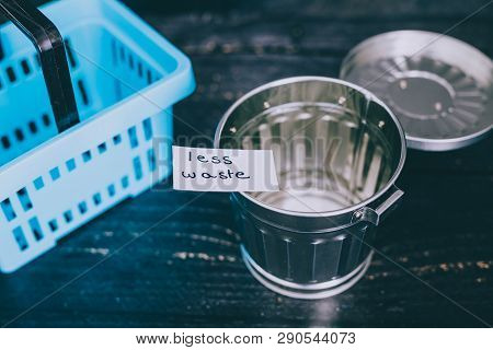 Spend Better For Less Waste Shopping Basket Next To Gargabe Bin
