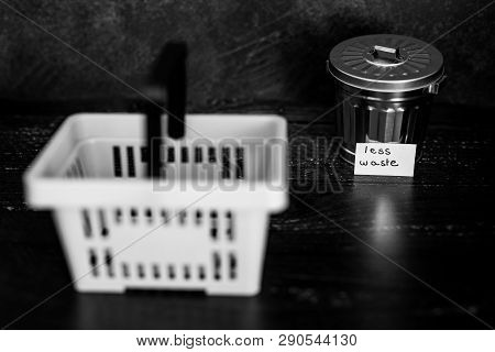 Spend Better For Less Waste Shopping Basket Next To Gargabe Bin