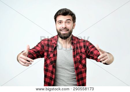 Hispanic Young Man With Berad Argueing With His Boss Or Wife.