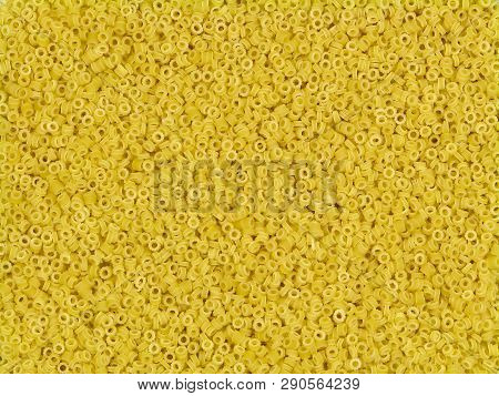 Uncooked Yellow Italian Pasta Anelli Random Texture Top View Close-up