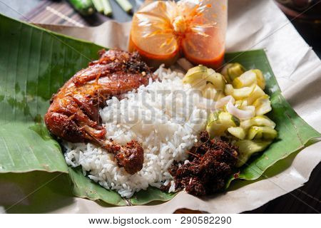 Nasi lemak kukus with chicken, popular traditional Malay local food.