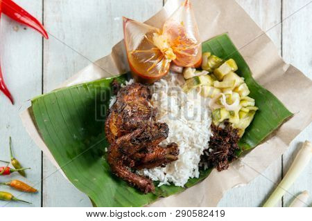 Nasi lemak kukus with quail, popular traditional Malay local food.