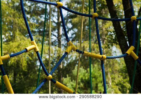 Detail Of Rope Climbing Frame  For Children.blue, Green And Yellow Ropes With Yellow Plastic Clutchs