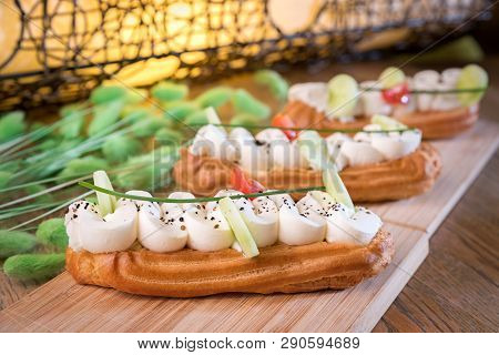 Homemade Cheese Mousse And Truffle Eclair On A Table