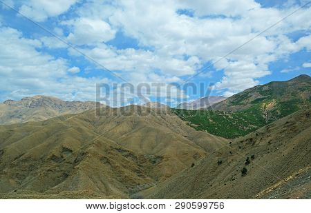 High Atlas Mountains In Morocco. In Some Places Covered With Dense Forests, In Places Completely Des