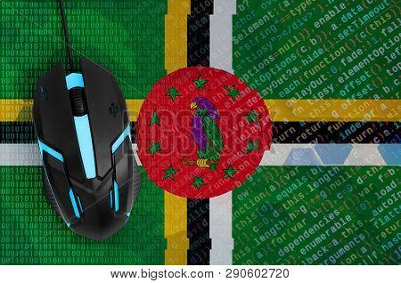 Dominica Flag  And Computer Mouse. Digital Threat, Illegal Actions On The Internet