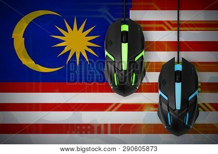 Malaysia Flag  And Two Mice With Backlight. Online Cooperative Games. Cyber Sport Team