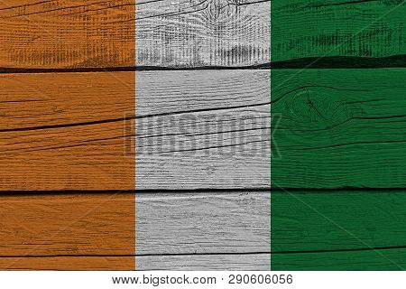 Cote Divoire - Ivory Coast Flag Painted On Old Wood Plank. Patriotic Background. National Flag Of Co
