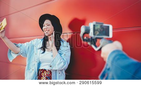 Asian Fashion Girl Vlogging And Using Mobile Smartphone Outdoor - Happy Trendy Chinese Woman Having 