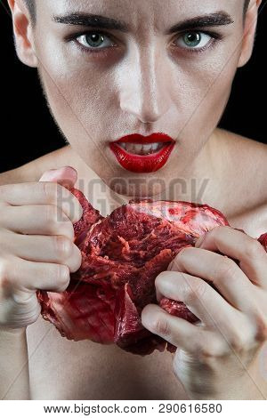 Close-up Woman With Red Lips Going To Eat Raw Meat. Portrait Of Girl With Beautiful Face Makeup Biti