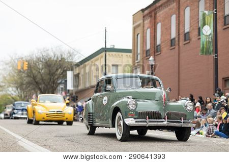 Holland, Michigan, Usa - May 12, 2018 A Green Studebaker Skyway Land Cruiser 1941 Goes Down The Road