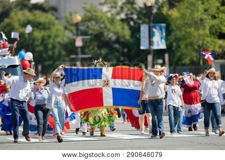 Washington, D.c., Usa - September 29, 2018: The Fiesta Dc Parade, People Carry The Flag Of The Domin