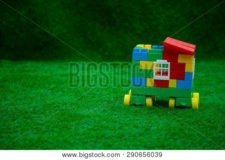 The house of the cubes stands on green grass
