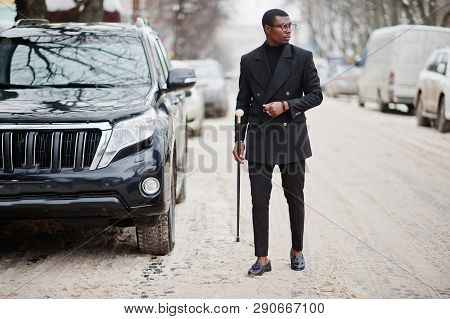 Stylish African American Gentleman In Elegant Black Jacket, Holding Retro Walking Stick As Cane Flas