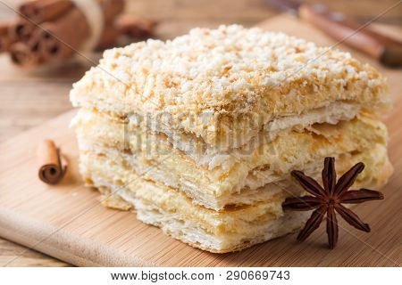 Layered Cake With Cream Napoleon Millefeuille Vanilla Slice With Cinnamon And Anise On Wooden Backgr