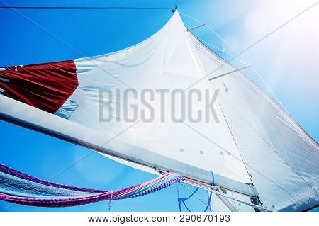 Sails Of A Sailing Yacht In The Wind
