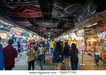 Hualien, Taiwan - March 2019: People Walking At Night Market Located In Hualien City, Taiwan. This P