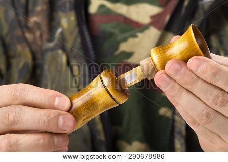 Disassembled Wooden Single Reed Call In The Hands Of A Waterfowler, Closeup