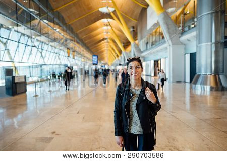 Young Smiling Woman Traveling With Carry On Backpack Hand Luggage.travel To Destination With Low Cos