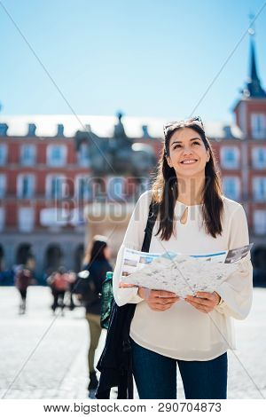 Young Happy Woman Exploring Center  Of Madrid. Visiting Famous Landmarks And Places.cheerful Female